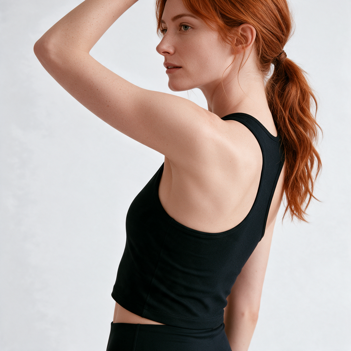 Natural Crop Racer Tank in Black — armhole profile
