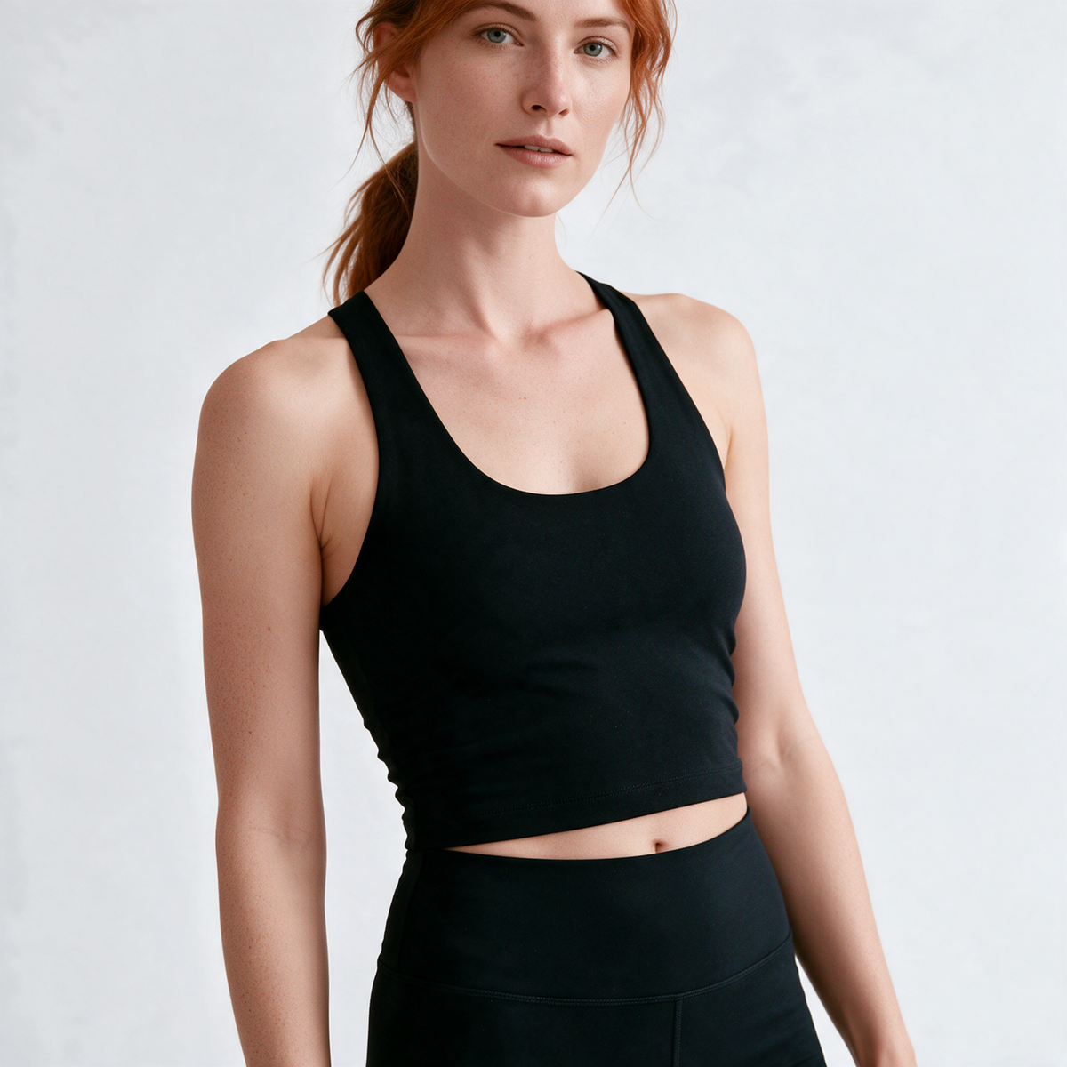 Natural Crop Racer Tank in Black — front three-quarter