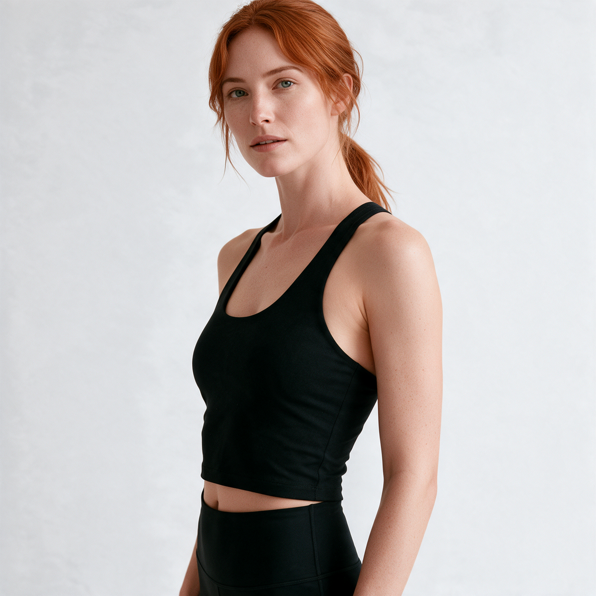 Natural Crop Racer Tank in Black — half-turn fit