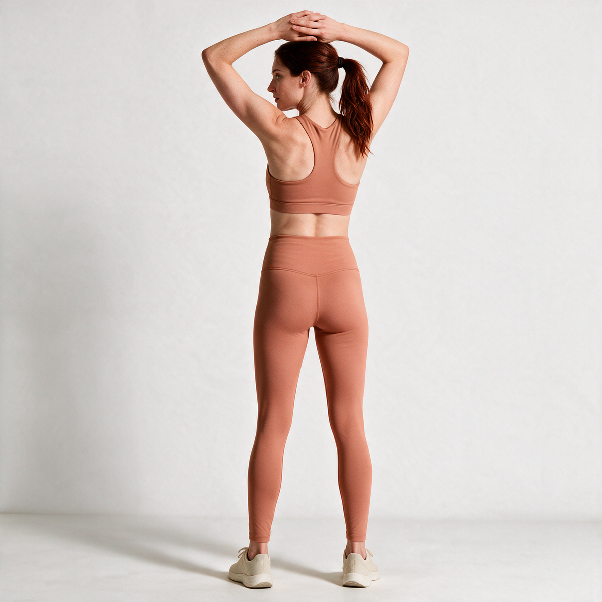 Natural Performance Full Length Leggings in Light Orange — rear view with arms overhead